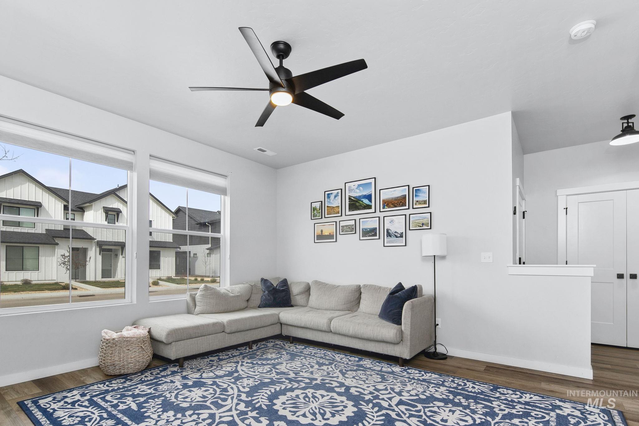 298 South Fritts Avenue Meridian, ID 83642 - Photo 5 of 32 Living room with dark wood finished floors and a ceiling fan