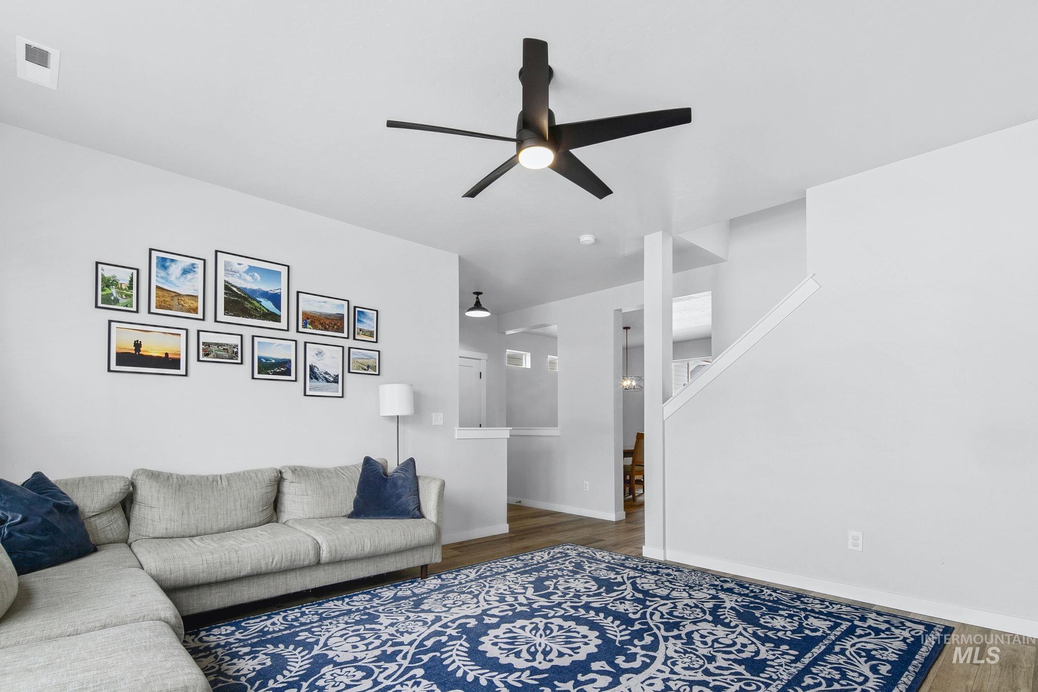 298 South Fritts Avenue Meridian, ID 83642 - Photo 6 of 32 Living room featuring dark wood-style floors and ceiling fan