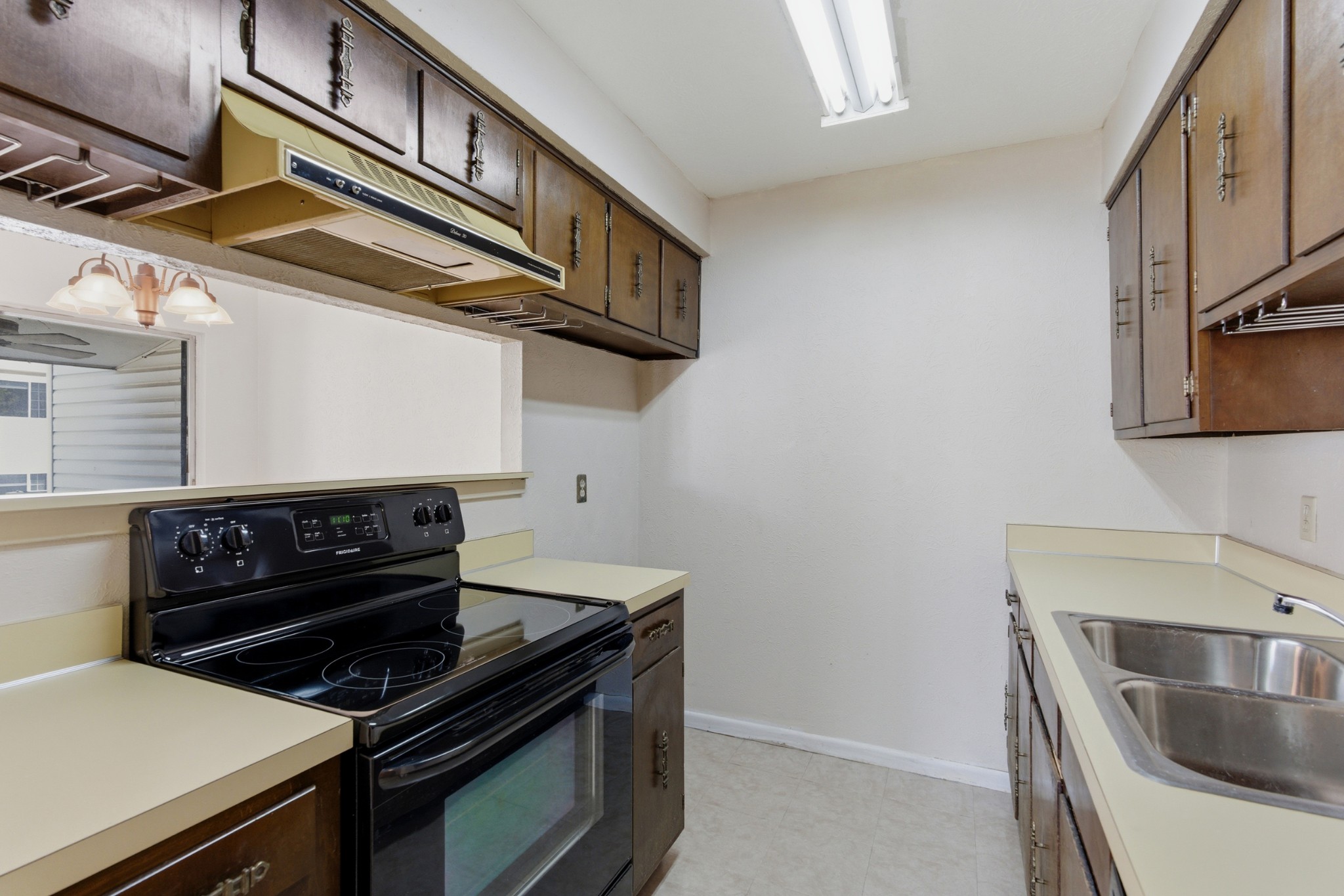 810 Bellevue Road, Unit 202 Nashville, TN 37221 - Photo 11 of 17 a kitchen with a stove and a sink
