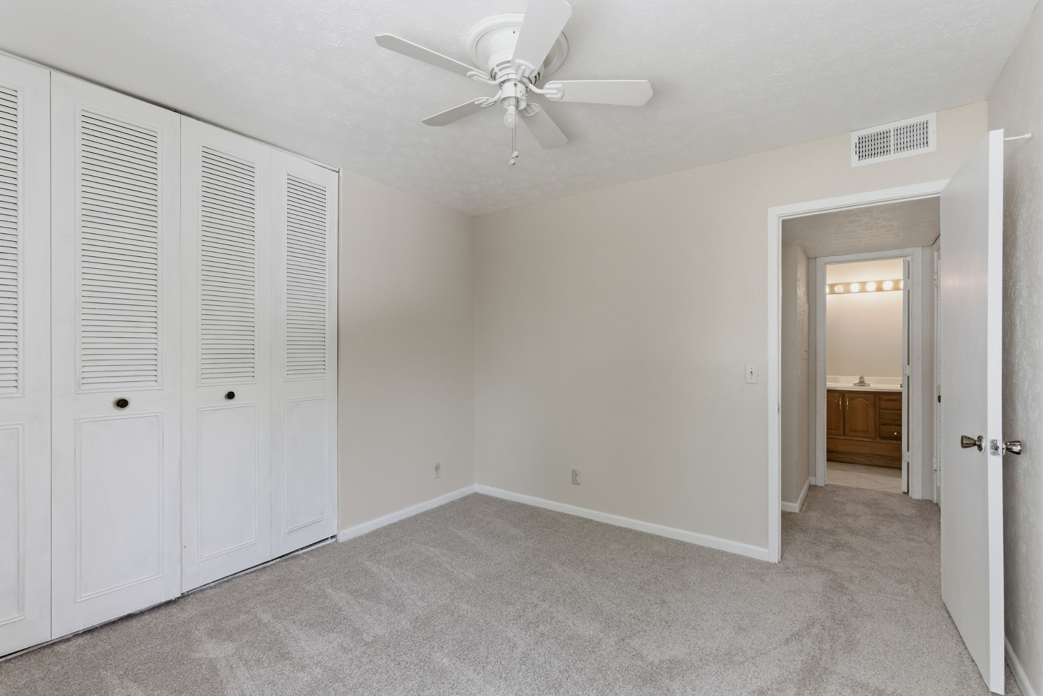 810 Bellevue Road, Unit 202 Nashville, TN 37221 - Photo 16 of 17 an empty room with a ceiling fan and a window