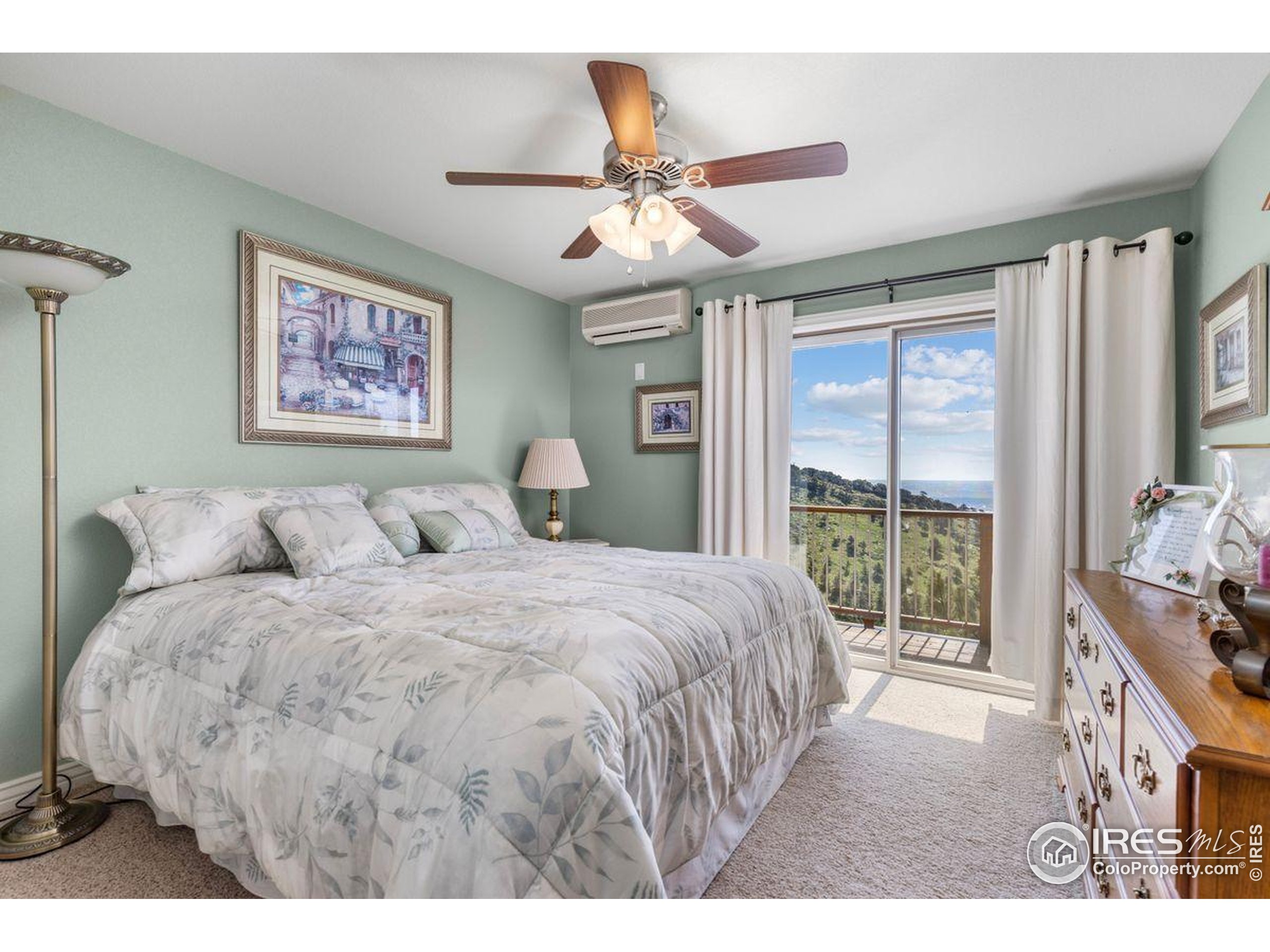 6183 Red Hill Road Boulder, CO 80302 - Photo 13 of 34 a bedroom with a large bed and a window