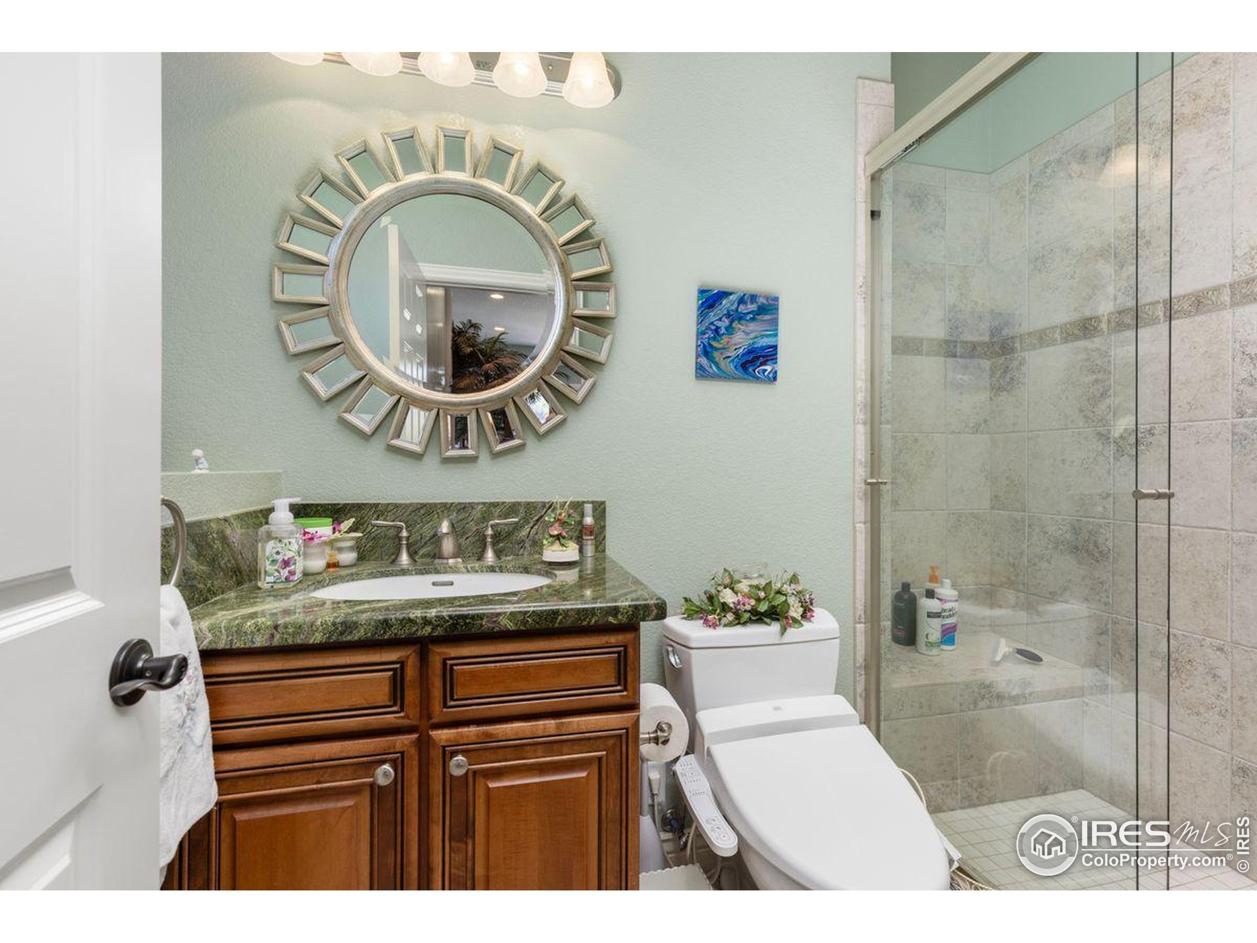 6183 Red Hill Road Boulder, CO 80302 - Photo 19 of 34 a bathroom with a sink a mirror and a toilet