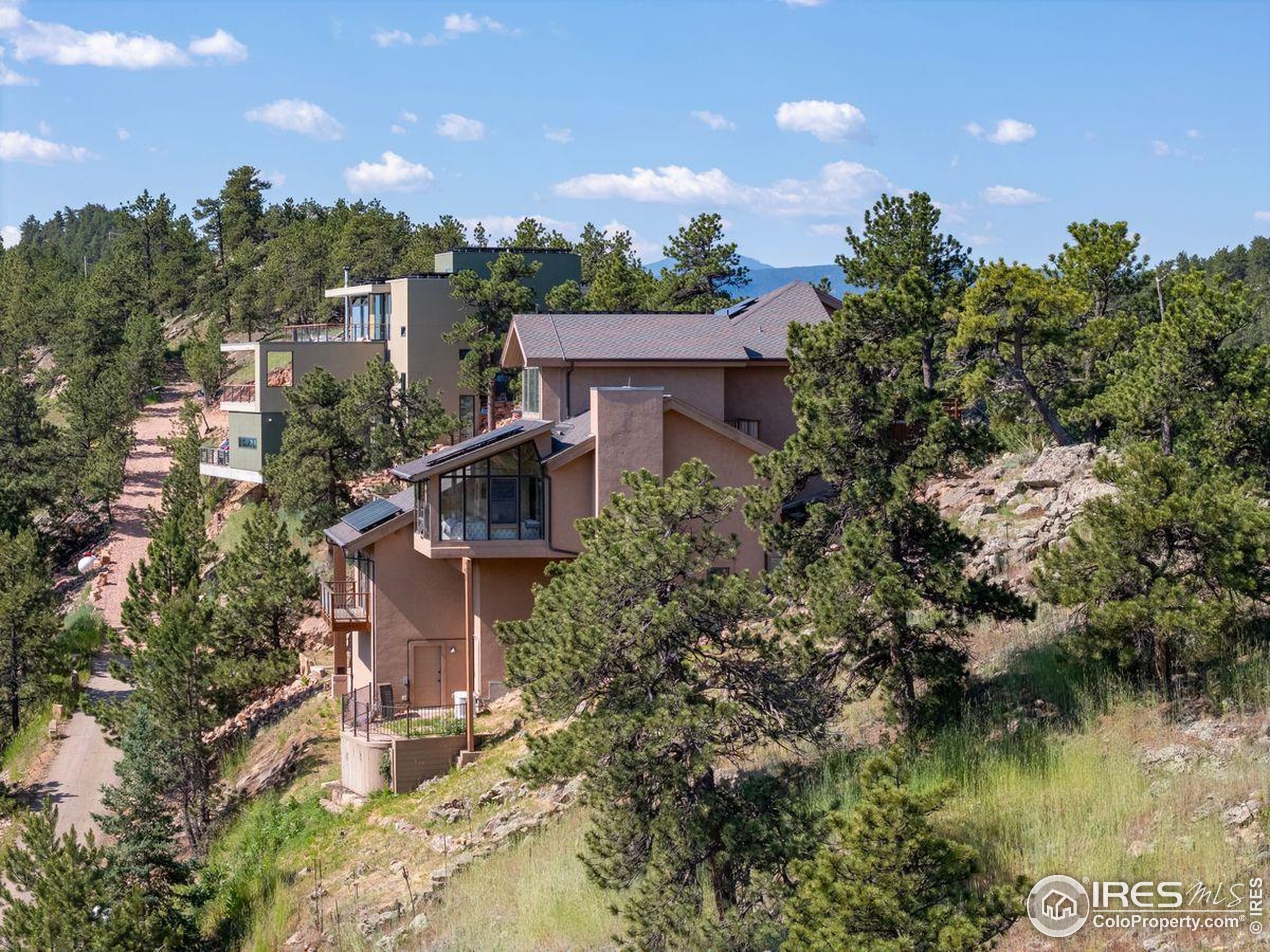 6183 Red Hill Road Boulder, CO 80302 - Photo 24 of 34 an aerial view of a house with a yard and lake view