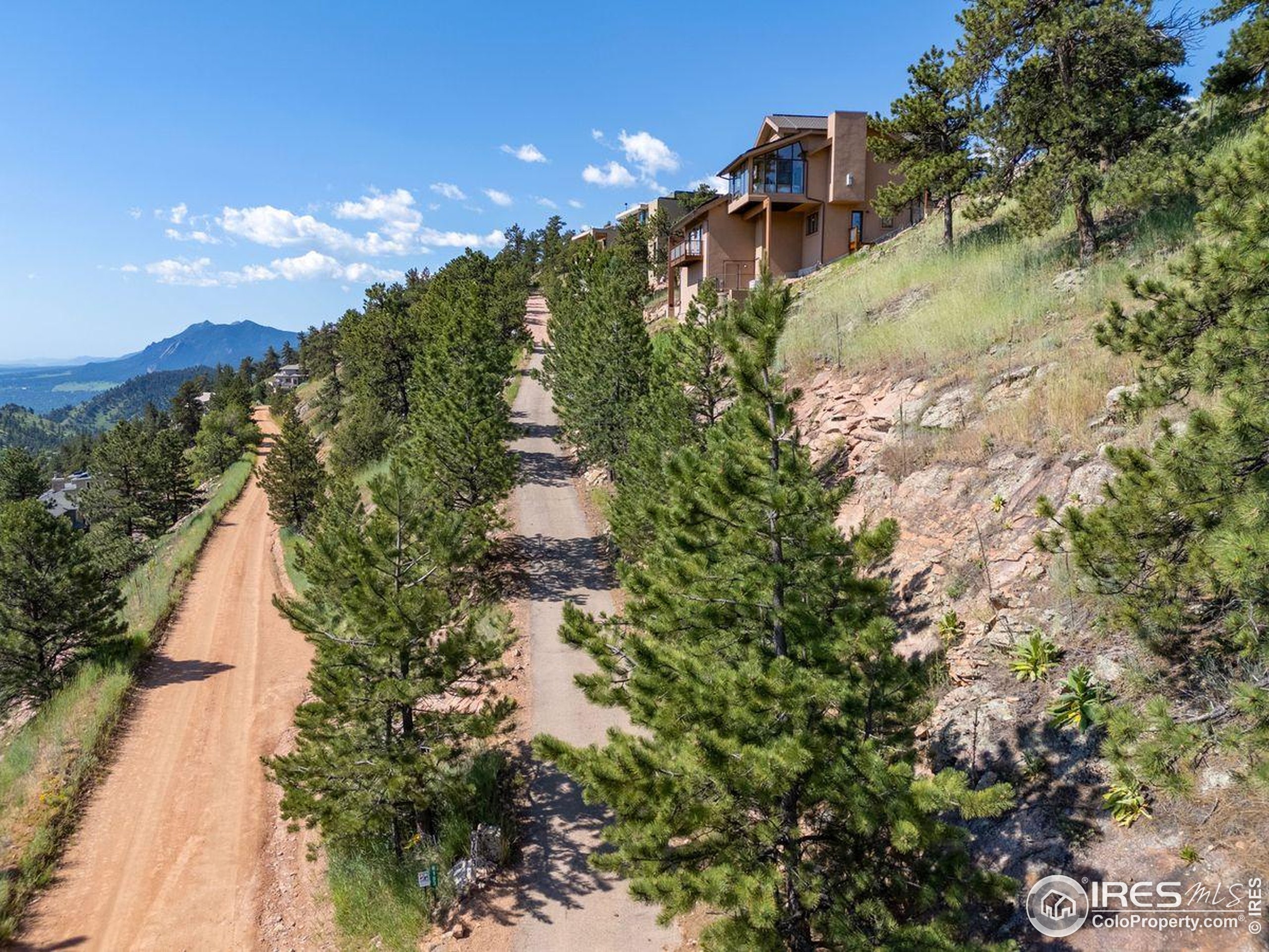 6183 Red Hill Road Boulder, CO 80302 - Photo 29 of 34 a view of a house with a yard