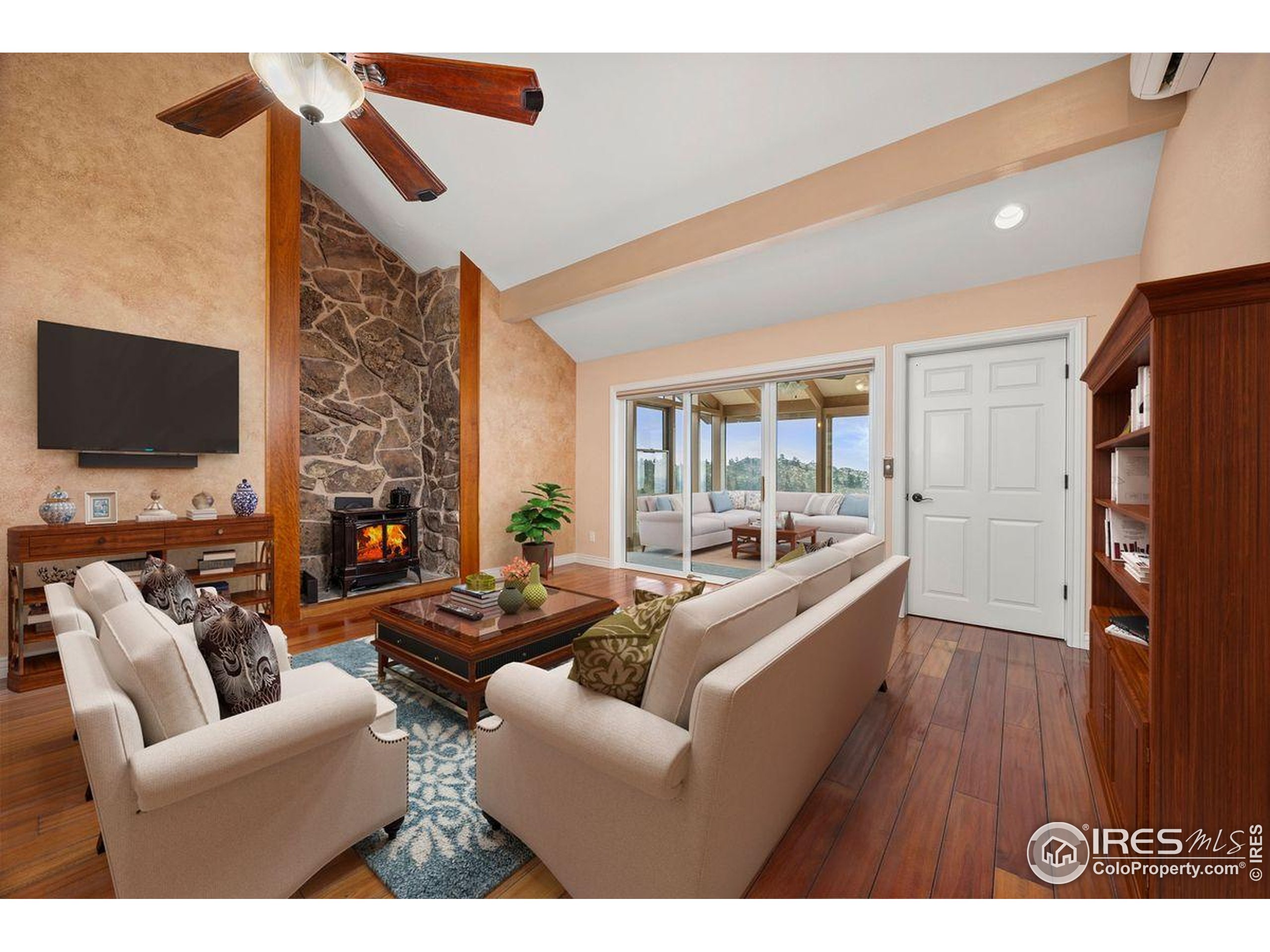 6183 Red Hill Road Boulder, CO 80302 - Photo 8 of 34 a living room with furniture and a flat screen tv