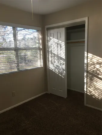 a view of an empty room with a window