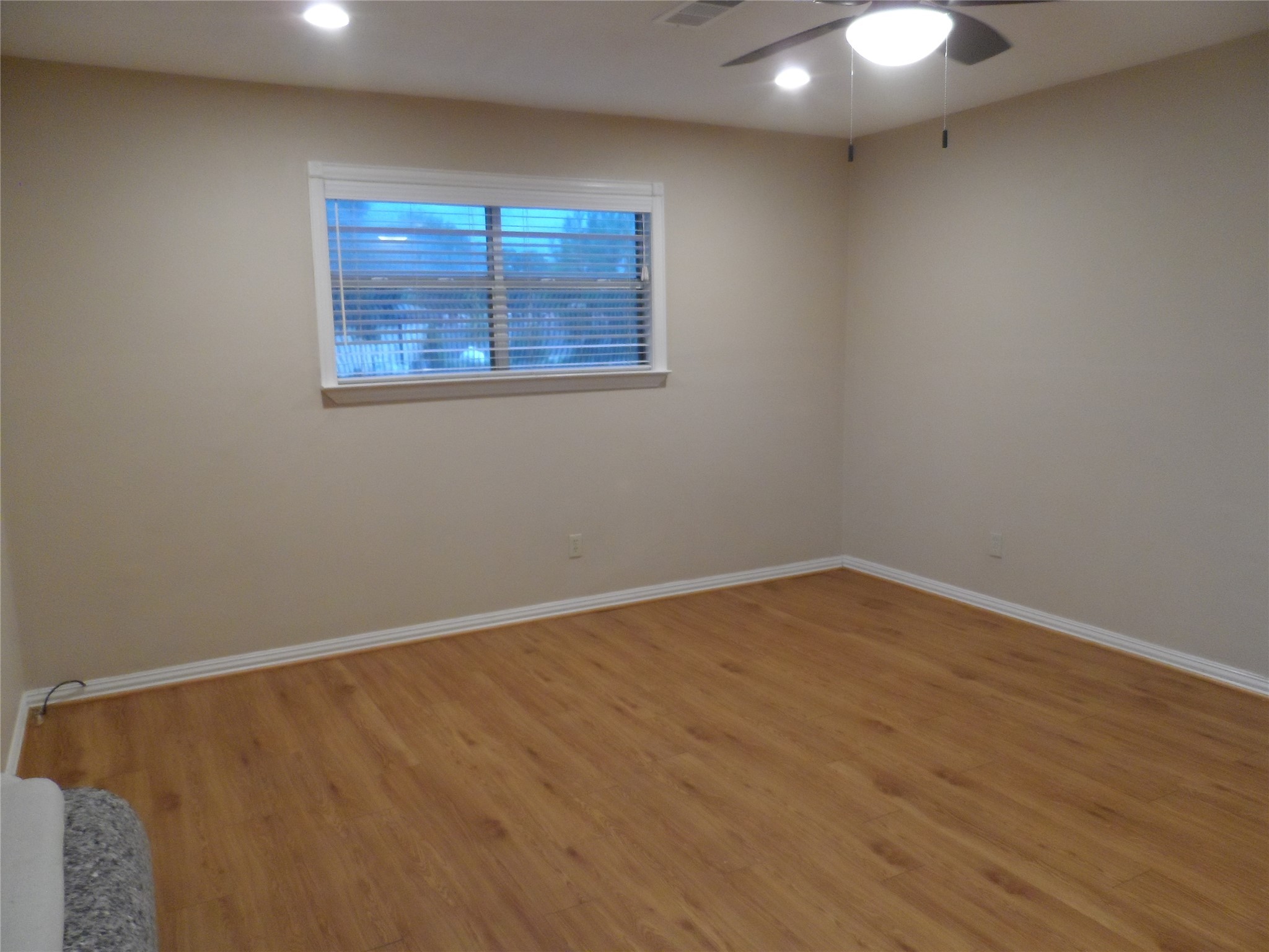 2283 McCaleb Road Montgomery, TX 77316 - Photo 25 of 45 an empty room with wooden floor and windows