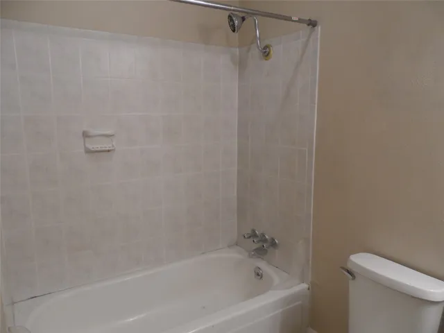 a view of a balcony next to a yard