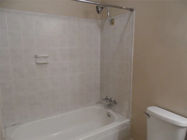 an empty room with a empty space and windows