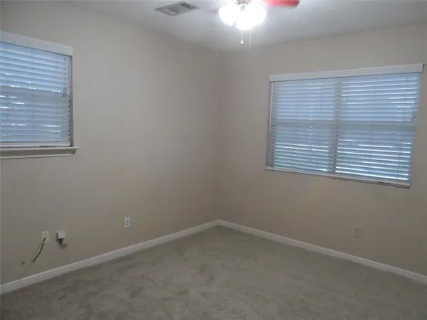 a view of a balcony next to a yard