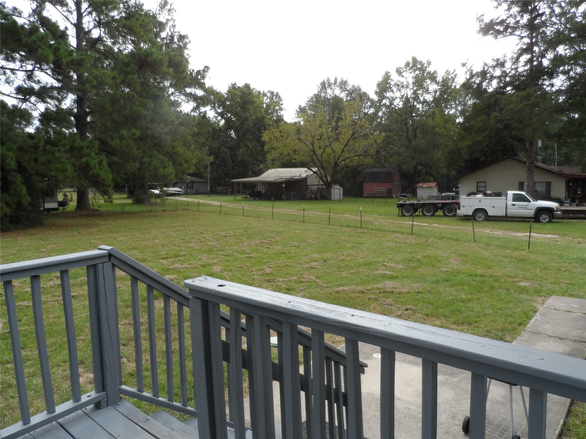 2283 McCaleb Road Montgomery, TX 77316 - Photo 43 of 45 a view of a wooden deck and garden with trees