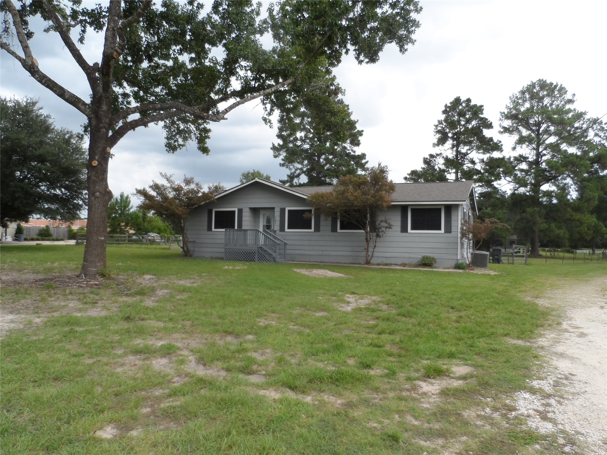 2283 McCaleb Road Montgomery, TX 77316 - Photo 45 of 45 a backyard of a house with table and chairs
