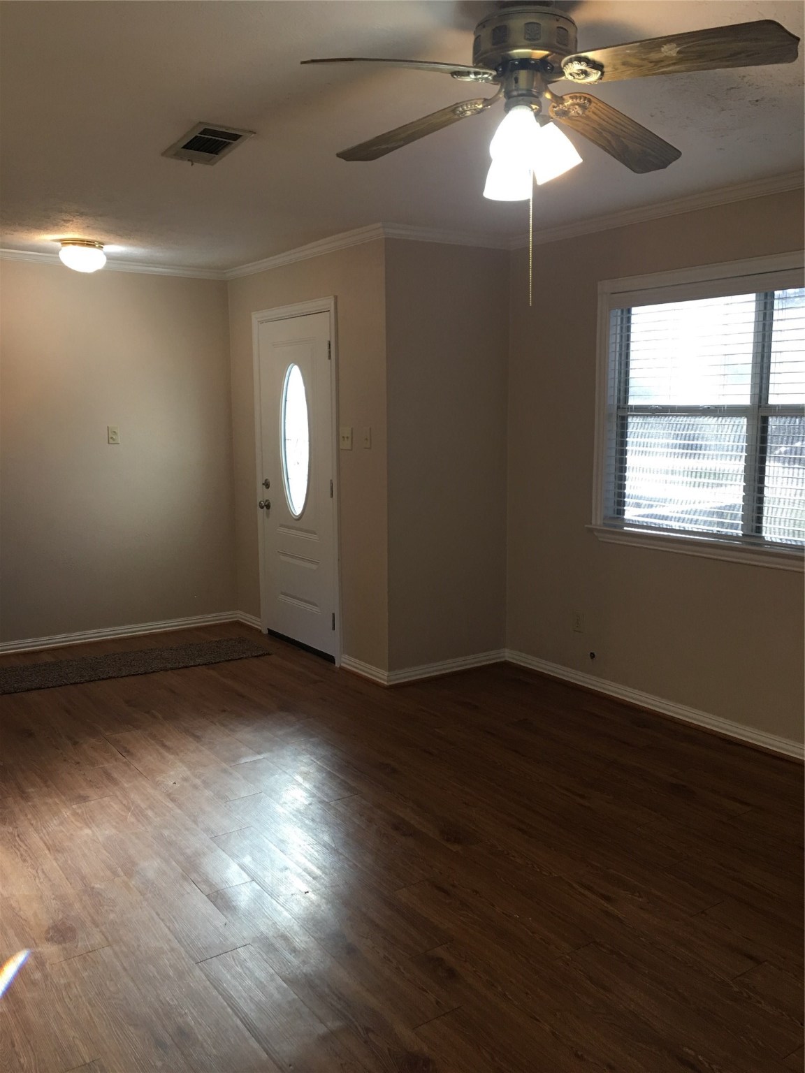 2283 McCaleb Road Montgomery, TX 77316 - Photo 6 of 45 a view of an empty room with wooden floor and a window
