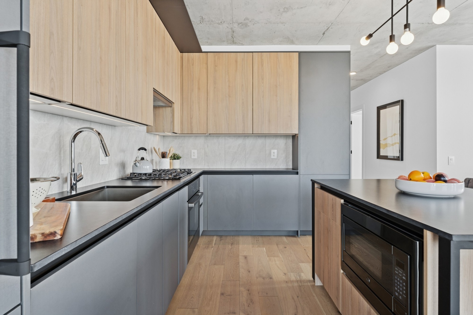 234 West Polk Street, Unit 2802 Chicago, IL 60605 - Photo 11 of 39 a kitchen with stainless steel appliances a sink stove and cabinets