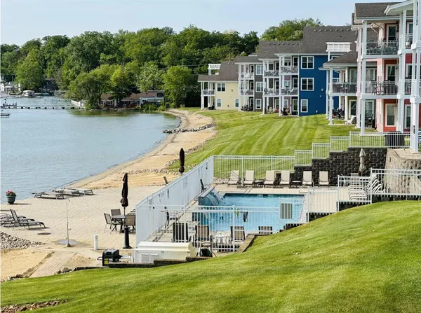 a very nice looking living room with kitchen and a couch