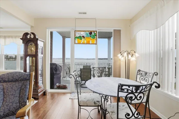 a kitchen with stainless steel appliances granite countertop a stove microwave and refrigerator