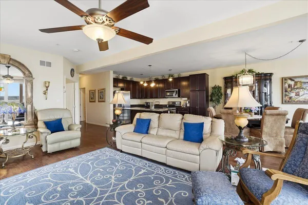 a kitchen with sink and view living room