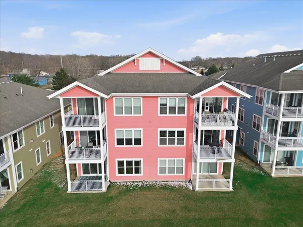 a view of a brick house with a yard