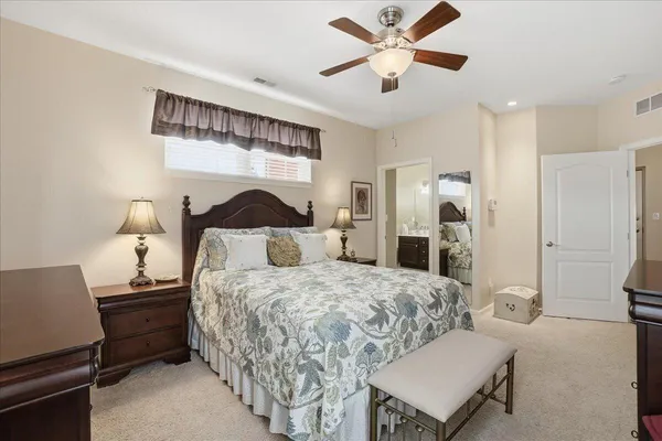 a bedroom with a bed and a table