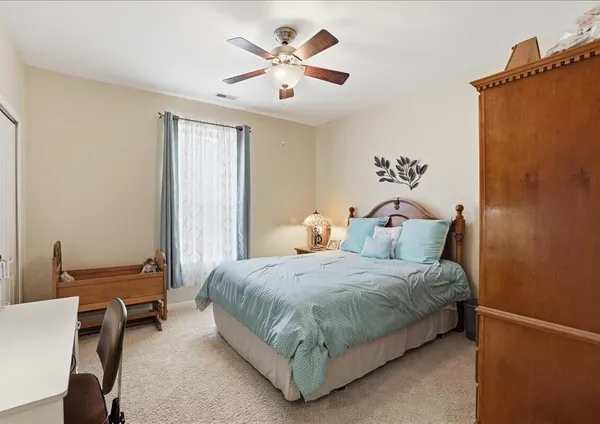 a bathroom with a tub a sink and a mirror