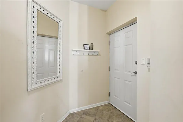 a view of a hallway with closet