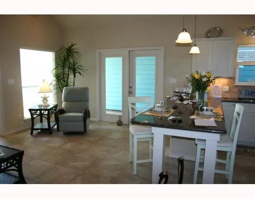 a kitchen with furniture and window