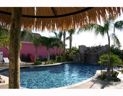 a view of swimming pool with a patio