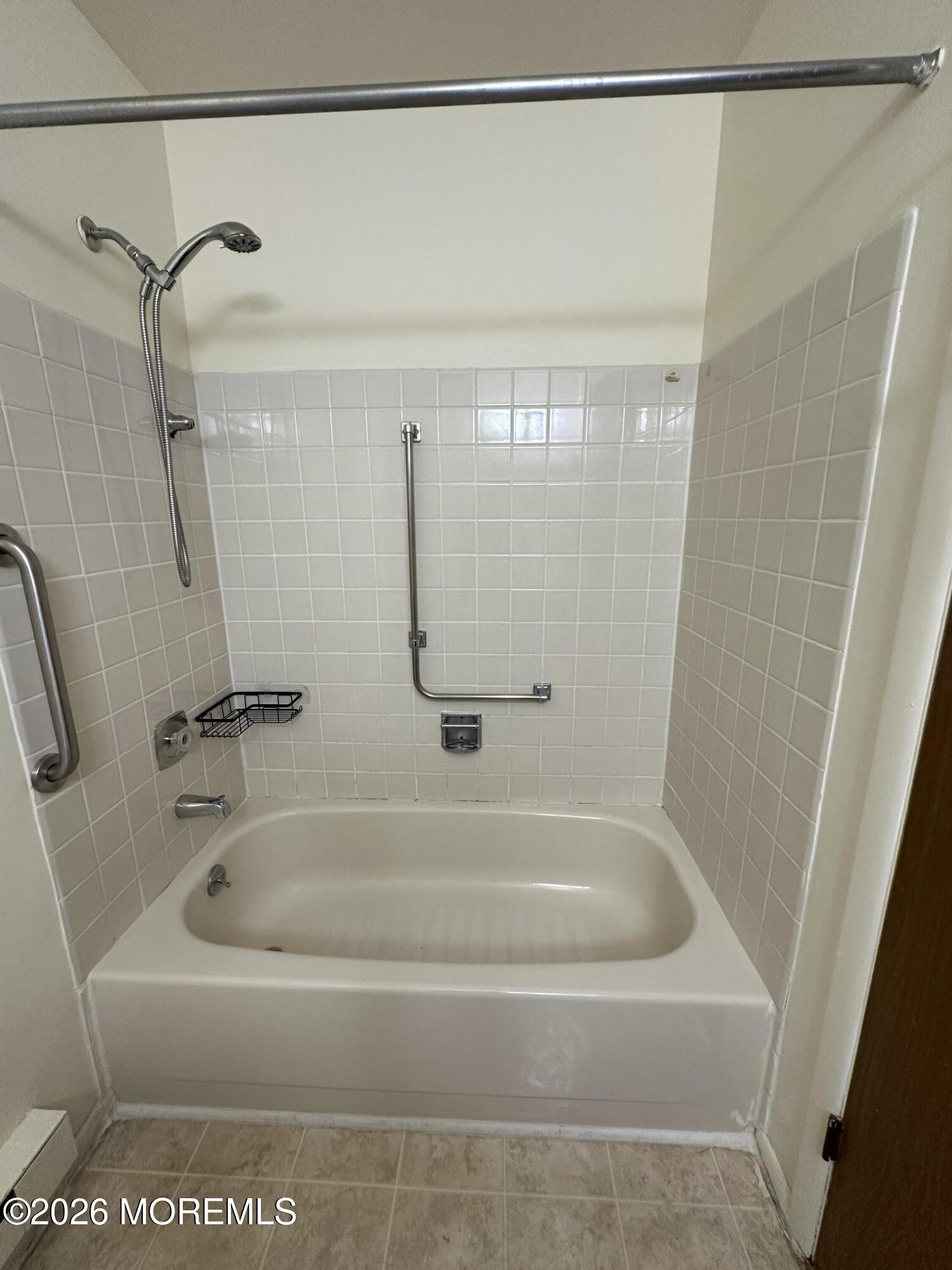 2B Fallbrook Street, Unit 52 Whiting, NJ 08759 - Photo 14 of 14 a bathroom with a bath tub and a shower