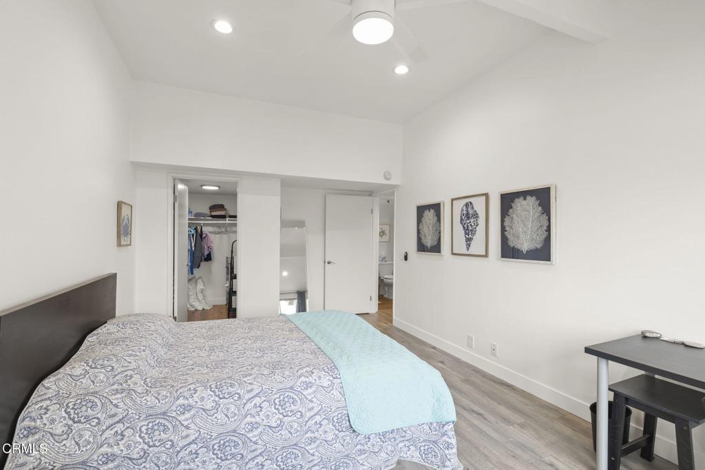 3464 Sunset Lane Oxnard, CA 93035 - Photo 24 of 46 a bedroom with a bed and painting on the wall