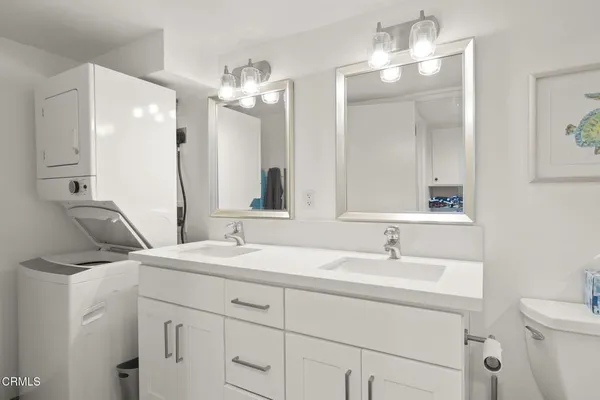 a bathroom with a sink vanity and a mirror