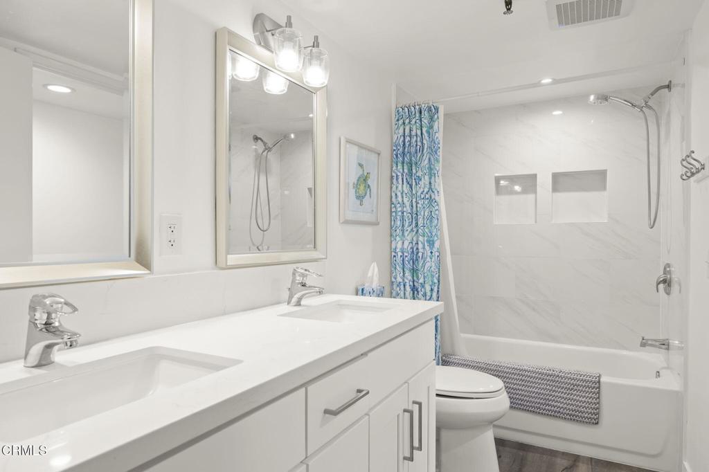 3464 Sunset Lane Oxnard, CA 93035 - Photo 27 of 46 a bathroom with a sink a toilet and shower