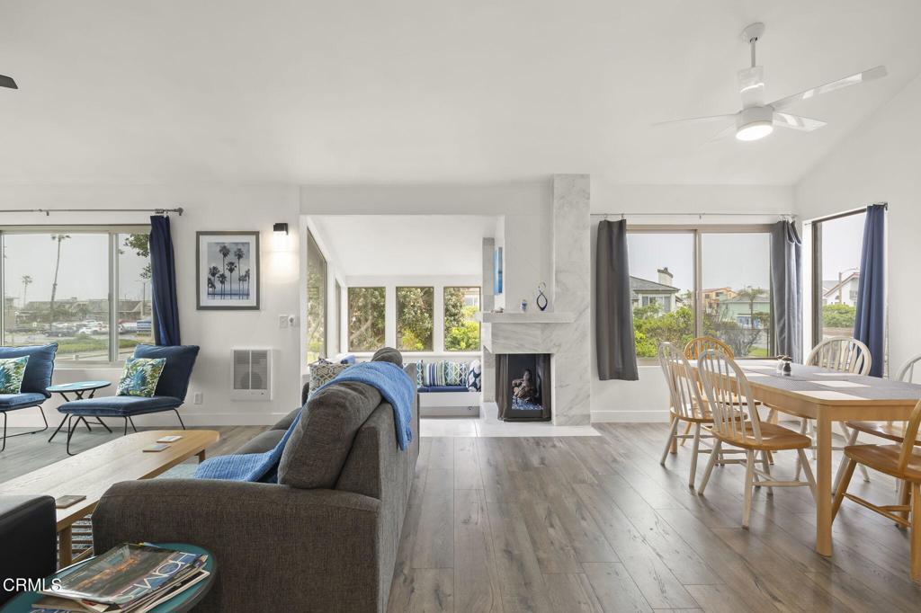 3464 Sunset Lane Oxnard, CA 93035 - Photo 7 of 46 a living room with furniture fireplace and a large window
