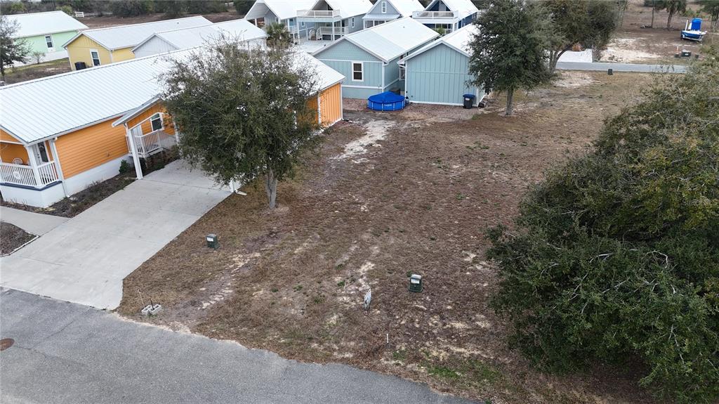 an aerial view of a house with a yard and a garage