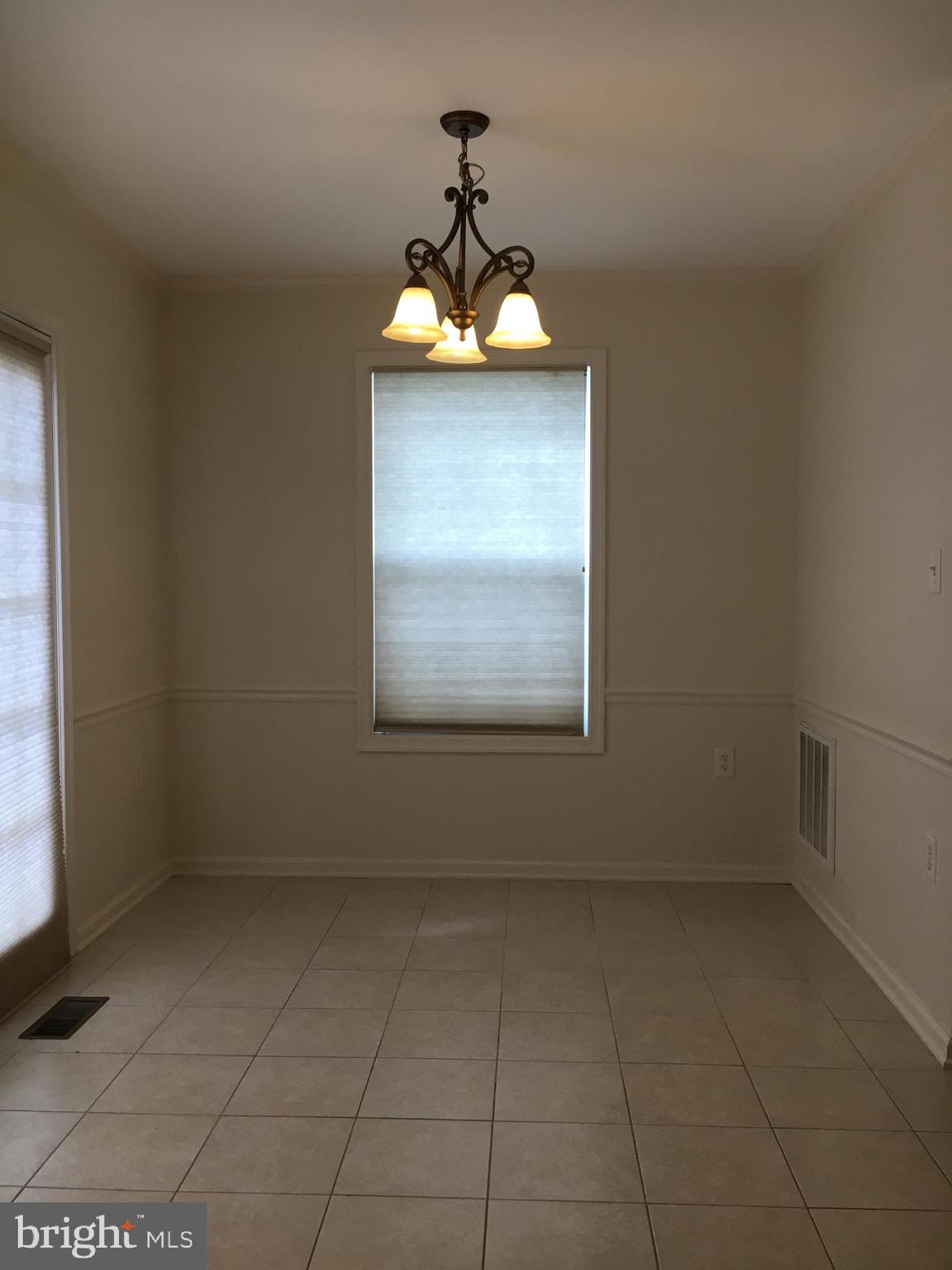 300 East 5th Avenue Ranson, WV 25438 - Photo 8 of 21 Dining area off kitchen leads to deck