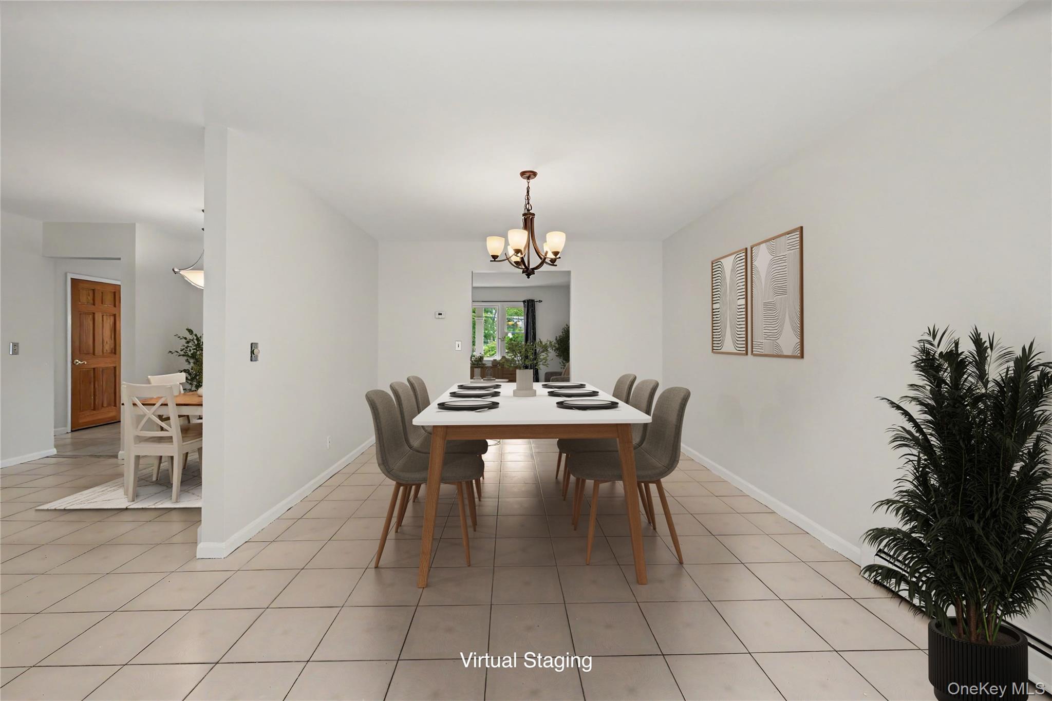 568 Manville Road, Unit UPPER R Pleasantville, NY 10570 - Photo 9 of 32 Virtually staged spacious room featuring neutral tile flooring, light neutral wall paint, and a multi-arm chandelier. Eat-in Kitchen is to the left.