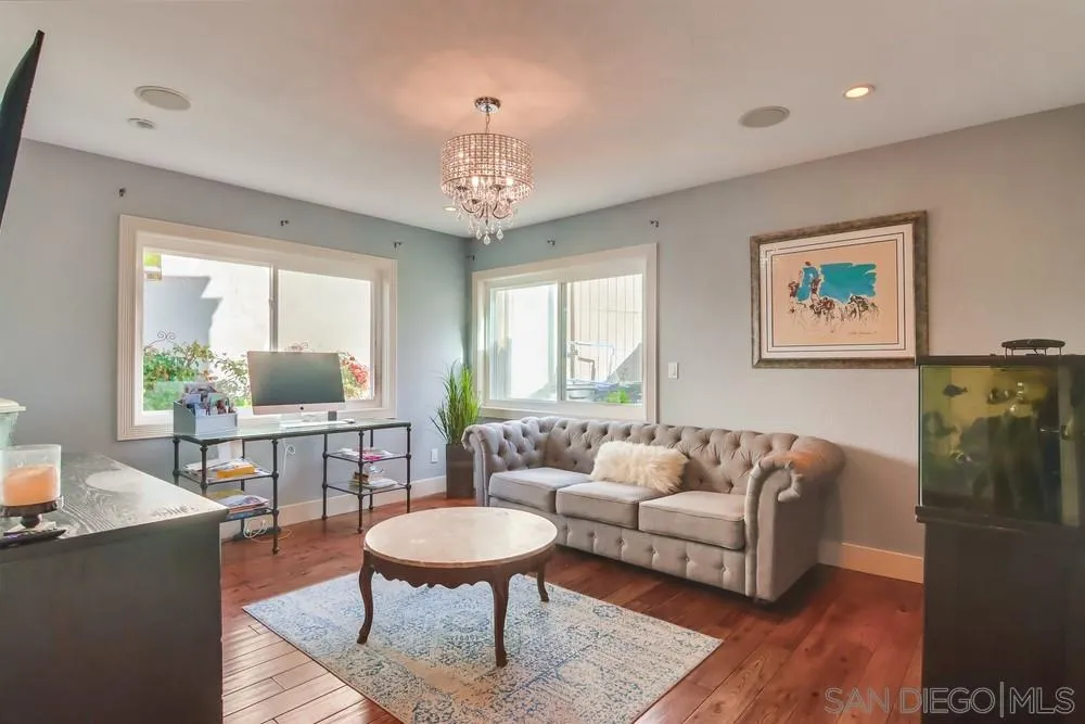 40 Bahama Bend Coronado, CA 92118 - Photo 14 of 36 a living room with furniture and a wooden floor
