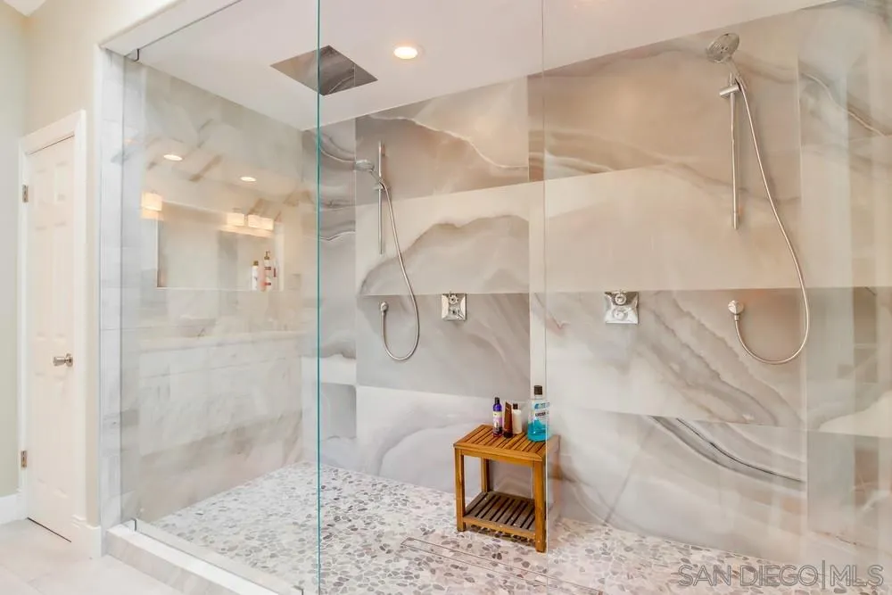 40 Bahama Bend Coronado, CA 92118 - Photo 20 of 36 a bathroom with a shower and a mirror