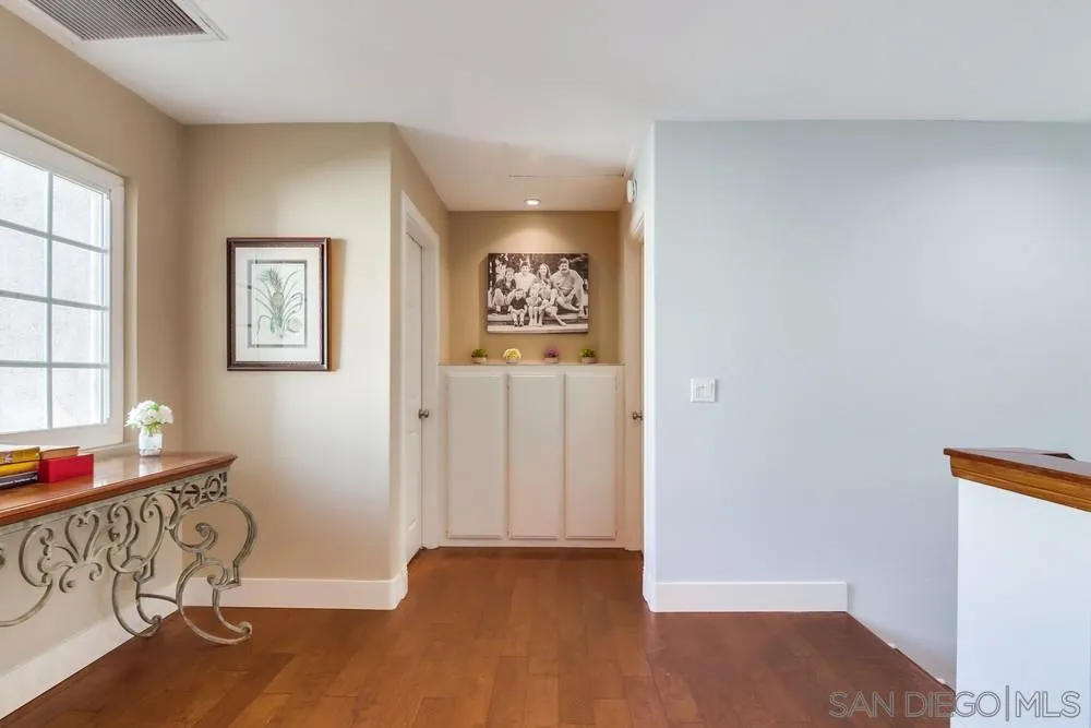 40 Bahama Bend Coronado, CA 92118 - Photo 24 of 36 a view of room with window and wooden floor
