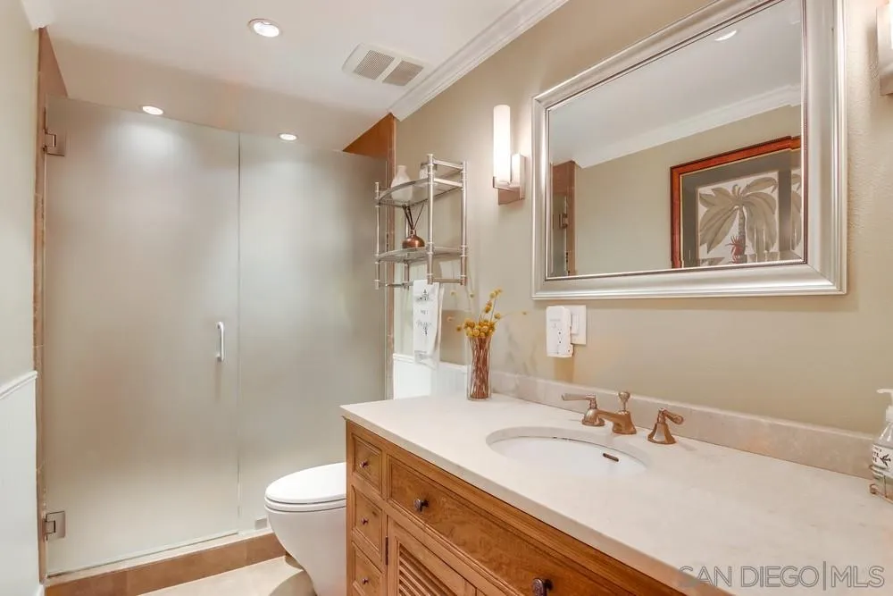 40 Bahama Bend Coronado, CA 92118 - Photo 30 of 36 a bathroom with a sink a toilet and shower
