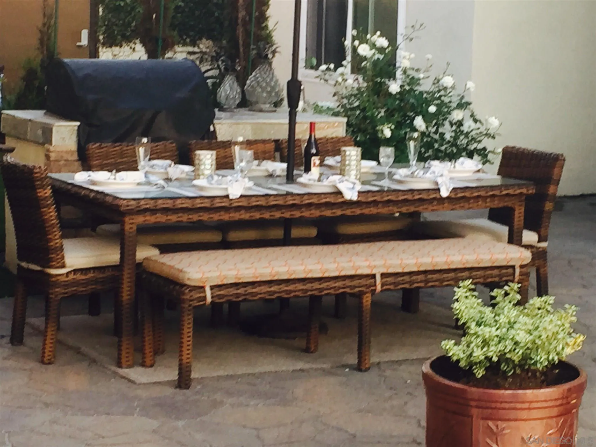 40 Bahama Bend Coronado, CA 92118 - Photo 34 of 36 a view of a patio with table and chairs potted plants