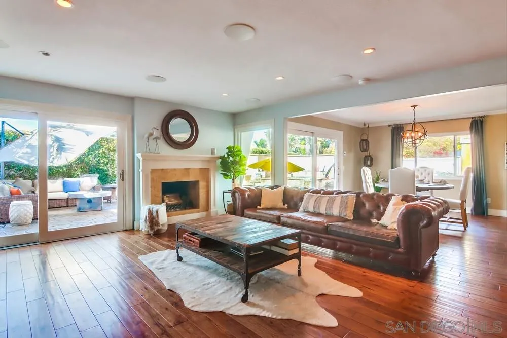 40 Bahama Bend Coronado, CA 92118 - Photo 5 of 36 a living room with furniture a large window and a fireplace