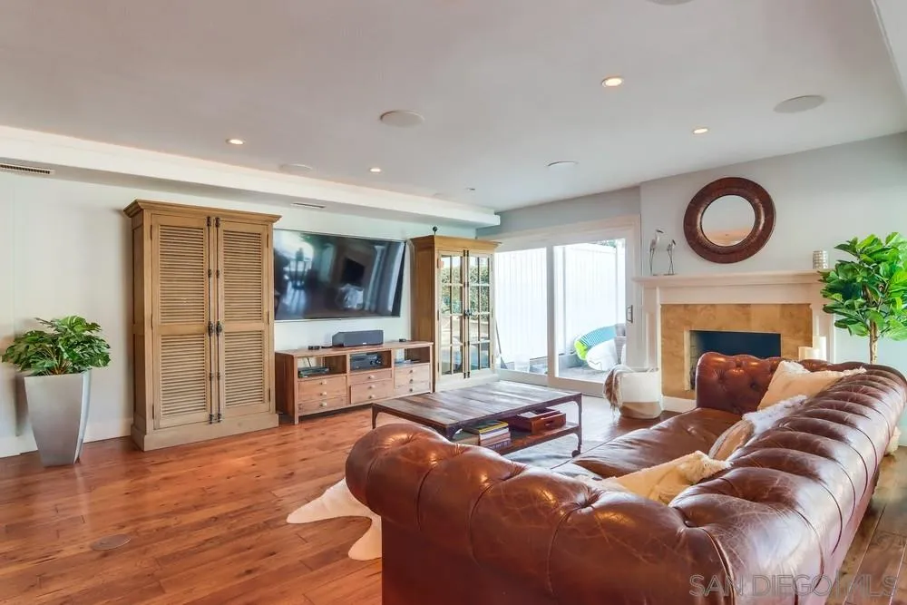 40 Bahama Bend Coronado, CA 92118 - Photo 7 of 36 a living room with furniture a fireplace and a flat screen tv