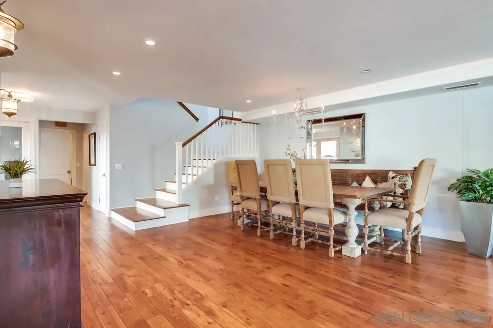 40 Bahama Bend Coronado, CA 92118 - Photo 8 of 36 a view of a dining room with furniture and wooden floor