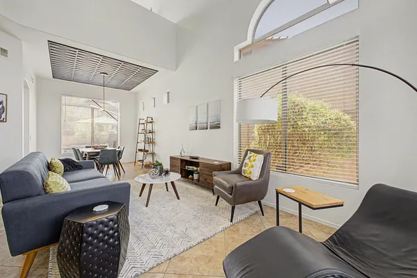 a living room with furniture and a window