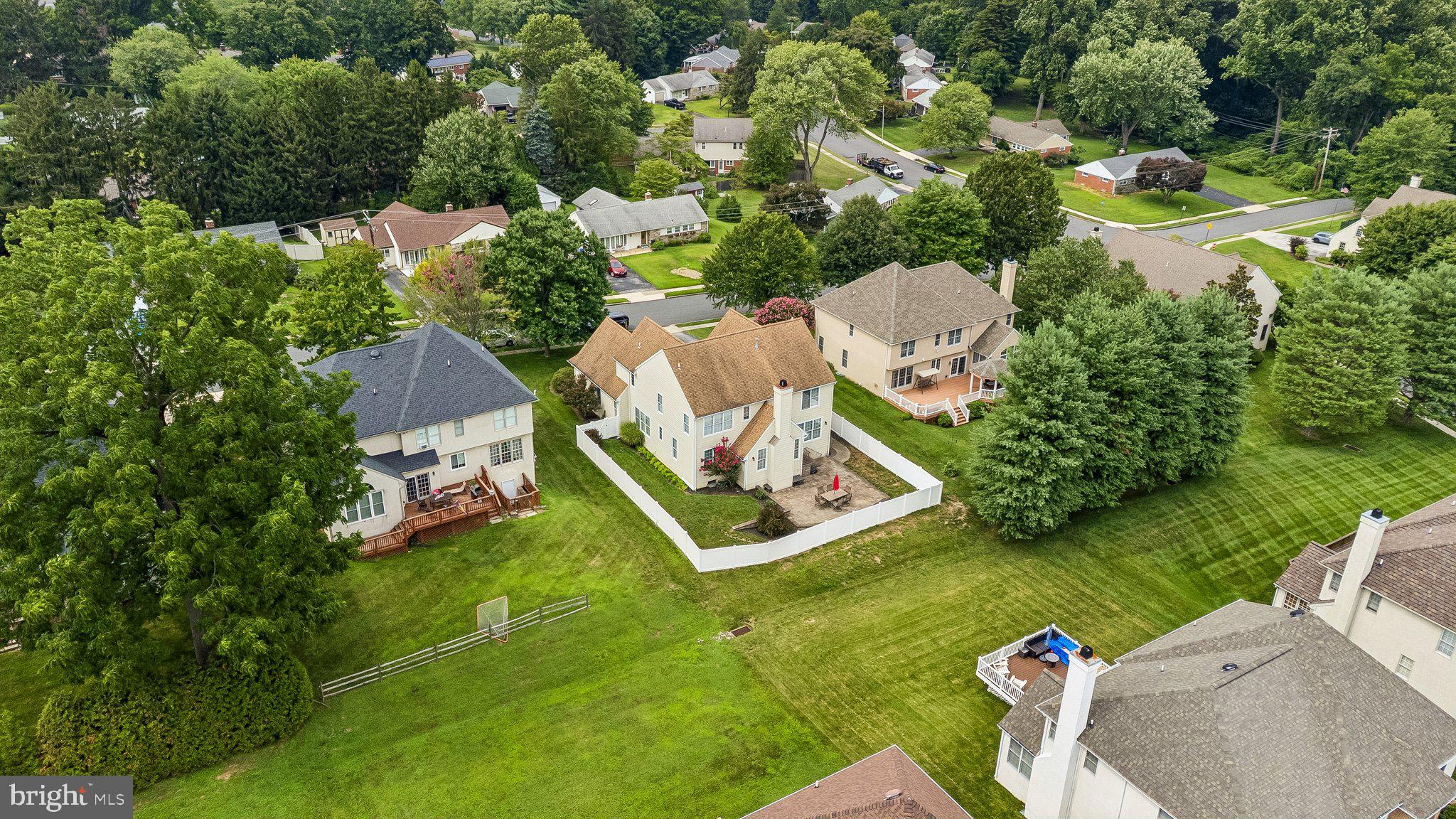 305 Langford Road Broomall, PA 19008 - Photo 81 of 83 an aerial view of a house with swimming pool a yard and mountain view in back