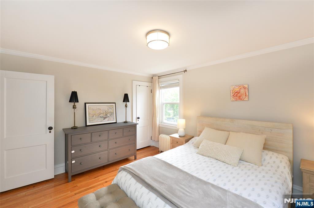570 Shelton Road Ridgewood, NJ 07450 - Photo 15 of 26 a bedroom with a bed and a dresser