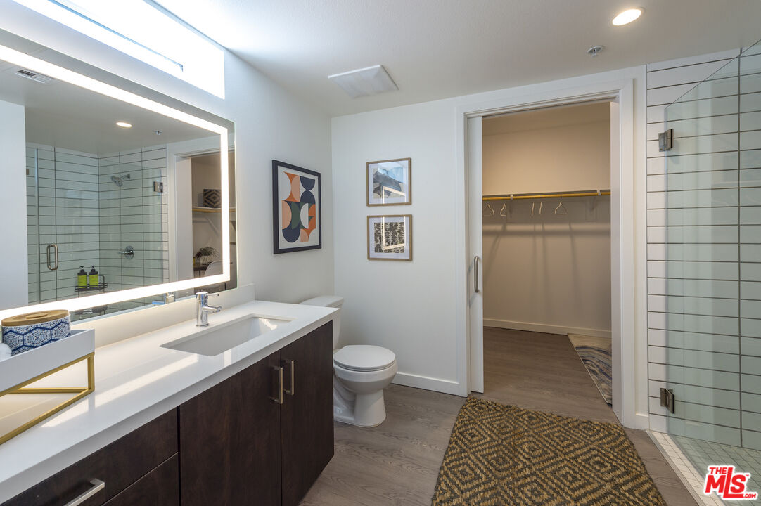2929 Pennsylvania Avenue, Unit 111 Santa Monica, CA 90404 - Photo 13 of 28 a bathroom with a sink a toilet a shower and a mirror