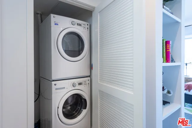 a view of a swimming pool with outdoor seating and plants