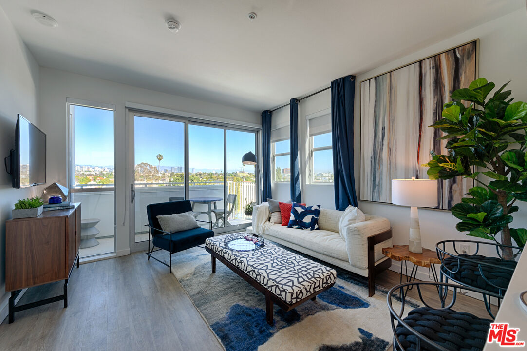 2929 Pennsylvania Avenue, Unit 111 Santa Monica, CA 90404 - Photo 19 of 28 a living room with furniture and a large window