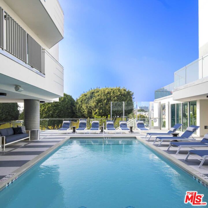 2929 Pennsylvania Avenue, Unit 111 Santa Monica, CA 90404 - Photo 2 of 28 a view of a swimming pool with outdoor seating